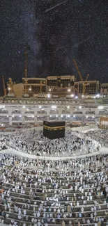 Mecca's Kaaba under a starry night sky with pilgrims surrounding it.