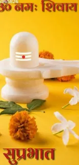 Sacred Shivling with flowers on yellow background.