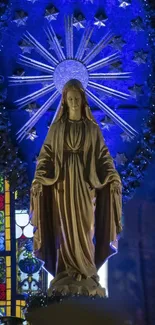 Statue with vibrant blue and stained glass background.