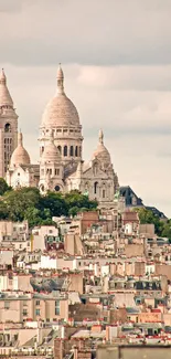 Aerial view of Sacré-Cœur Basilica in Paris with scenic rooftops and sky.