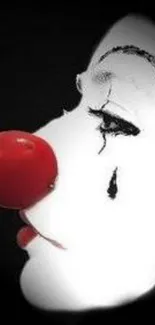 Sad clown face with red nose and black tear on mobile wallpaper.