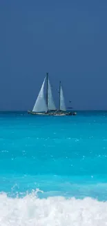 Sailboat gracefully sails on clear blue ocean under bright sky.