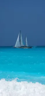 Sailboat on tranquil turquoise ocean with clear blue sky.