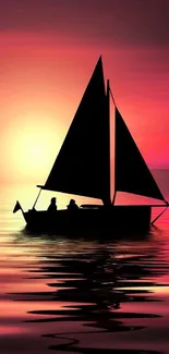 Sailboat silhouetted against a vibrant sunset over calm ocean waters.