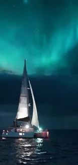 Sailboat on ocean under Northern Lights at night.