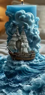 Blue candle with sailing ship design on ocean waves.