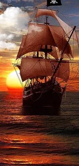 Silhouette of a sailing ship against a vibrant sunset over the ocean.