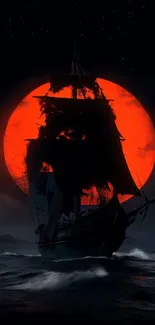 A silhouette ship sailing with a red moon backdrop.