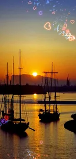 Sunset sailboats on calm waters with vibrant orange and blue hues.