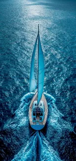 A sailing yacht glides over a shimmering blue ocean.
