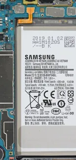 Samsung phone motherboard and battery in detailed view.