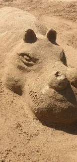 Creative sand sculpture of a hippo on the beach.