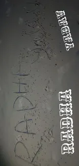 A dark sand beach wallpaper with hand-drawn text 'RADHA YADAV' on it.