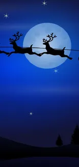 Santa's sleigh silhouetted against a full moon with stars.