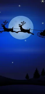 Santa’s sleigh silhouetted against a full moon with stars in dark blue night sky.