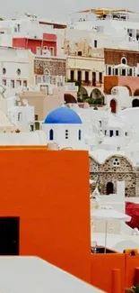 Colorful Santorini houses with blue domes in Greece.