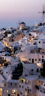Santorini at dusk with iconic architecture and soft twilight hues.