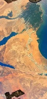 Satellite image of Earth displaying deserts and water bodies.