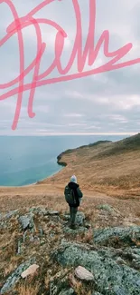 Traveler in scenic landscape by the coast with cloudy sky.