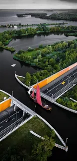 Aerial view of a bridge over green landscape and water.