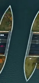 Aerial view of a scenic bridge over water, with vibrant trees.