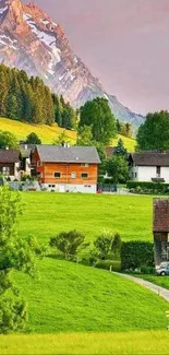 Charming Alpine village with green fields and mountains, perfect for serene wallpapers.