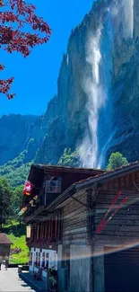 Serene Alpine village with a waterfall cascade.