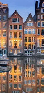 Reflection of Amsterdam canal houses in the evening.