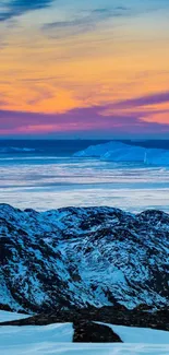 Breathtaking Arctic sunset with blue ice mountains and vibrant sky.