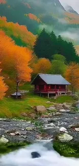 Autumn cabin by a stream with vibrant fall colors.