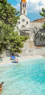 Picturesque beach with church and turquoise sea.