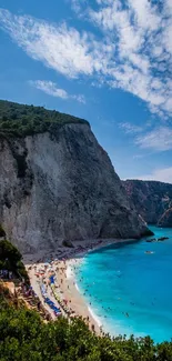 A breathtaking view of a beach and cliffs with vibrant blue skies.