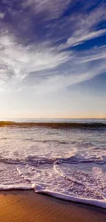 Serene beach sunset with ocean waves and vibrant sky.