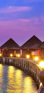 Scenic sunset view with beach huts and vibrant colors over water.