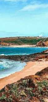 Scenic beachside view with a blue ocean and sandy shores, perfect for mobile wallpaper.