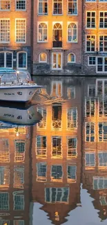 Peaceful canal with golden reflections of historic buildings at sunset.