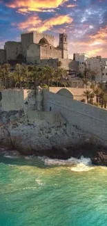 Beautiful coastal castle with sunset sky and turquoise ocean waves.