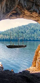 A serene lake view through a natural cave opening.