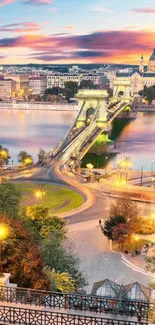 City bridge at dusk with illuminated lights and river view.