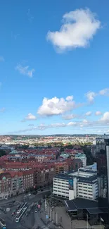 Aerial view of city skyline under vibrant blue sky.