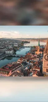 Aerial view of a European city with river and sunset sky.