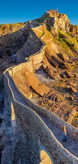 A scenic cliffside path with a vibrant blue sky overhead.