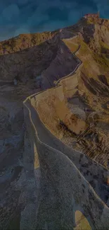 A breathtaking view of a winding path along a rugged cliffside.