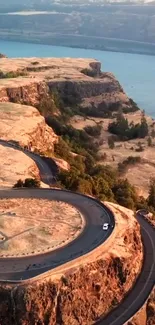 Aerial view of scenic cliffside road with breathtaking landscape.