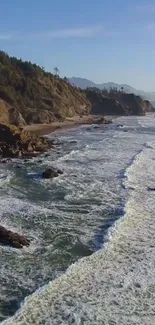 A breathtaking view of a coastal beach with waves crashing against rocky cliffs.