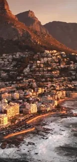 Sunlit coastal city with mountains at sunset.