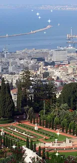 Coastal cityscape with gardens and sea view from above with clear sky.