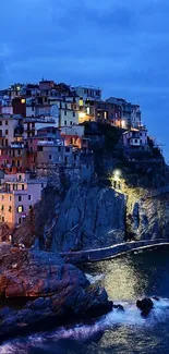 Scenic coastal village at twilight with rocky cliffs and ocean.