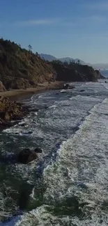 Coastal landscape with ocean waves and rocky shores under a blue sky.