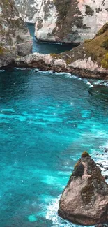 Scenic coastal view with turquoise waters and rock formations.